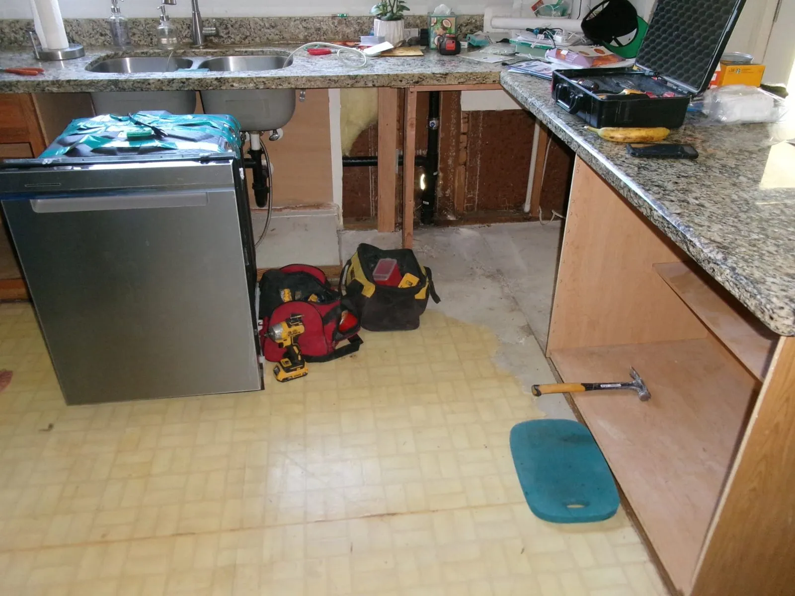 Sink cabinet water damage repair in progress in Phoenix, AZ